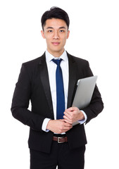 Wall Mural - Asian businessman hold with notebook computer