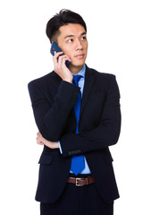 Wall Mural - Young businessman talk to mobile phone