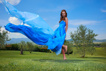 Sticker - Fashionable beautiful young woman in long blue dress posing with