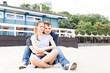 © ilya_oreshkov - Young couple relaxing sitting on the Baltic beach
