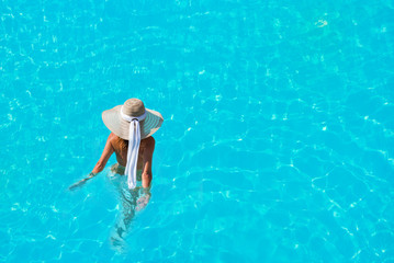 caucasian model playing into clear water