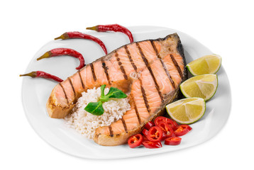 Wall Mural - Grilled salmon steak with vegetables on plate.