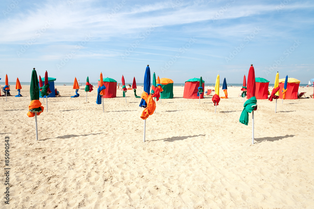 Colorful tents and umbrellas on famous Deauville beach, Normandy - obrazy, fototapety, plakaty 