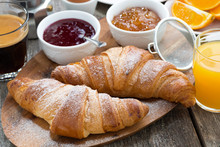 Delicious Breakfast With Fresh Croissants On Wooden Table