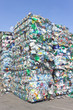 Stack of plastic bottles for recycling against blue sky