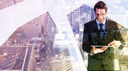 Poster - Composite image of businessman standing while using a tablet pc