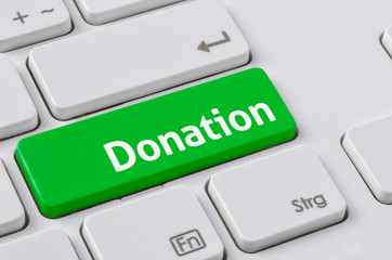 Wall Mural - a keyboard with a green button - donation