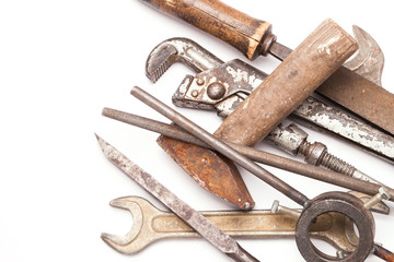 old metal work hand tools with rust on white