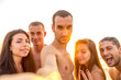 group of friends take a selfie at the beach - lifestyle concept