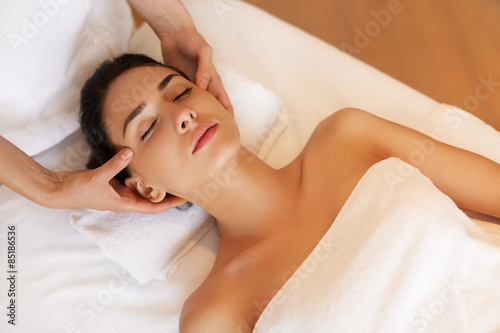 Fotografie, Tablou Beautiful Young Woman Getting a Face Treatment at Beauty Salon.