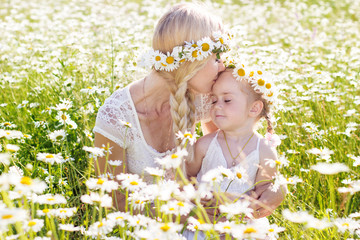 Wall Mural - Family mother and child in field of daisy flowers