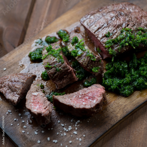 Fotografie, Tablou Medium rare grilled beef steak with chimichurri, selective focus