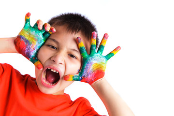 Little boy with hands painted in colorful paint