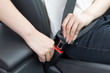 © zhu difeng - passenger fasten seat belt in car