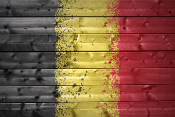 painted belgian flag on a wooden texture