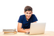 © Drobot Dean - Male student sitting at the table and using laptop