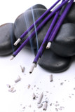 Incense and stones on a white background