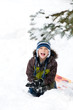 © sianc - young boy outdoors in winter clothing playing in the snow