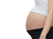 © birdnoifoto - Closeup of a pregnant belly, Isolated against white background