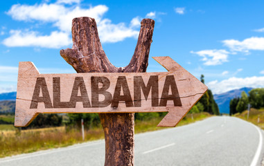 Wall Mural - Alabama wooden sign with road background