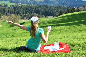 Canvas Print - Jug of milk on the Swiss flag. Emmental, Switzerland