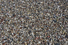 Wet Pebbly Beach Stone Background In Mediterranean Sea Beach