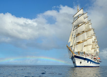Sailing Ship On The Background Of The Rainbow