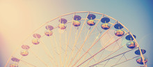 Vintage Filtered Picture Of A Ferris Wheel At Sunset.