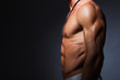 © sergiophoto - Muscular and fit torso of young sporty man showing his perfect