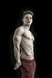 © theartofphoto - Handsome young bodybuilder in triceps pose