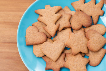 A blue bowl with homemade cookies