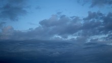 Bluish Darkening Clouds; Wide Angle Of View; Epic Clouds Moving Around In Their Natural Way; At Some Point There Is Even A Plane Flying Through Them; At The End They Become Extensively Dark.