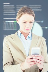 Poster - Composite image of businesswoman using her mobile phone