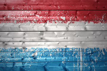 Wall Mural - painted luxembourg flag on a wooden texture