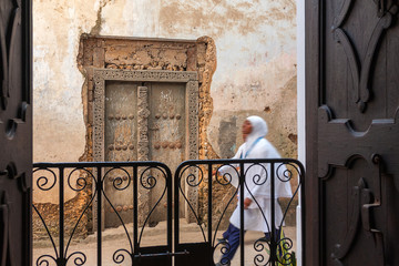 Wall Mural - alleyway door and pedestrian.