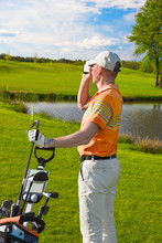 Man Golfer Watching Into Rangefinder