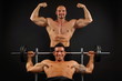 © petrdlouhy - Two muscular man posing with dumbells on dark background