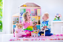 Kids Playing With Stuffed Animals And Doll House