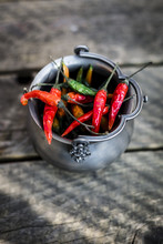Tin Vessel Of Red And Green Chili Pods