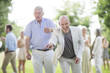 © Westend61 - Two happy men playing boules in park
