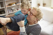 © Westend61 - Grandfather and grandson playing at home