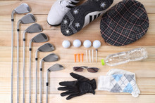 Golf Equipment On Wood Floor Preparing For Good Game