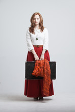 Woman In Vintage Red Skirt With A Suitcase