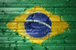 painted brazilian flag on a wooden texture
