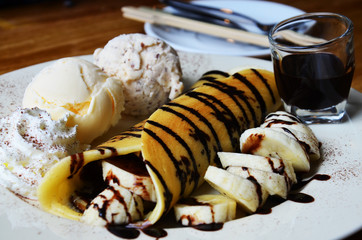 Banana pancake with ice cream and chocolate topping