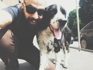 Bearded man and his dog friend taking selfie