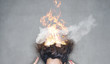 brunette woman head hair on fire in flames