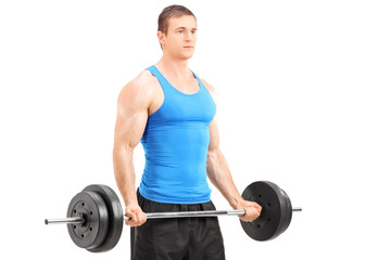 Canvas Print - Male athlete exercising with a barbell isolated on white