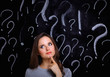 © shefkate - Young girl with question mark on a gray background