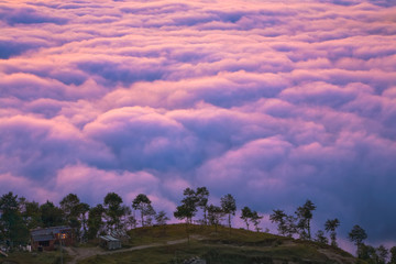 Wall Mural - life above the clouds / view on the nagarkot village (2,100 m) with the sea of clouds behind the hil